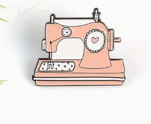 Pin de máquina de coser color melocotón