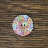 3/4 inch round, wooden, two hole button. White with printed picture.