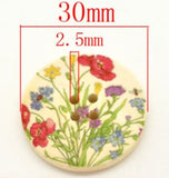 1 1/8 inch round wooden button with two holes. Feathering wild Flowers
