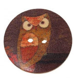 1 1/8 inch round wooden button with two holes. Feathering an owl #1