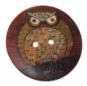 1 1/8 inch round wooden button with two holes. Feathering an owl #4